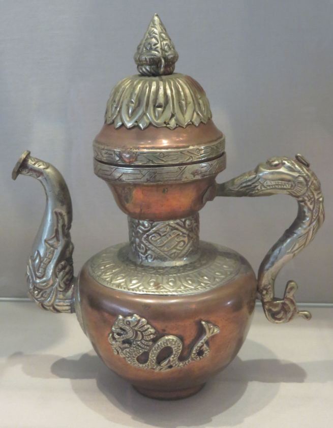 This is the type of teapot that would be found on a Tibetan Buddhist altar. Tea, which in Tibet is mixed with yak butter and salt, is used as an offering.